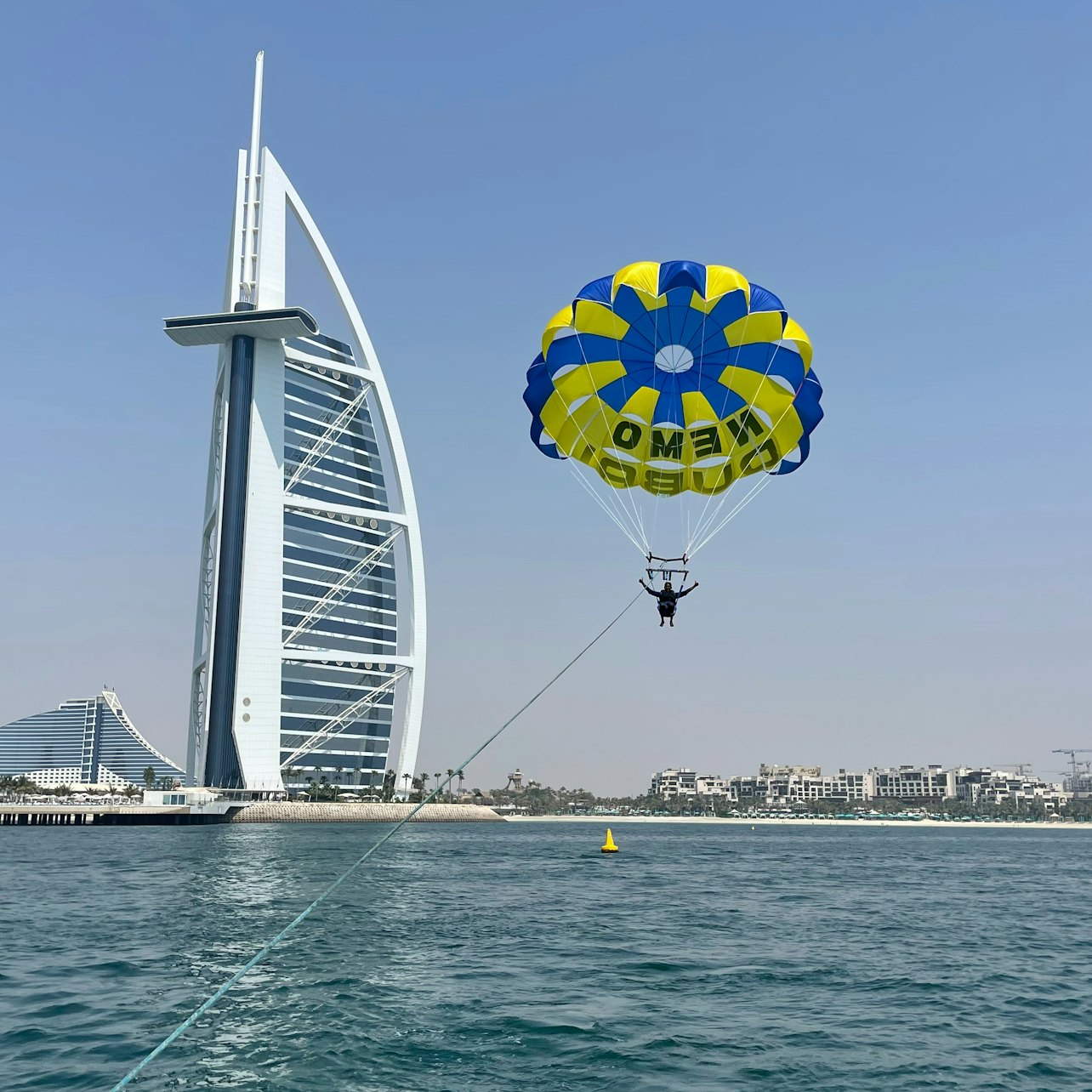 Soar high above Dubai's stunning coastline while taking in breathtaking views of the iconic Burj Al Arab. Experience the thrill of parasailing like never before!